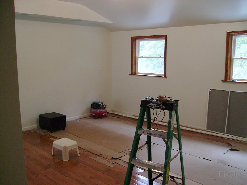 PICT0523.JPG - The windows ore trimmed out in oak. Speakers and reading lights in tray ceiling. Sub-woofer on the floor.