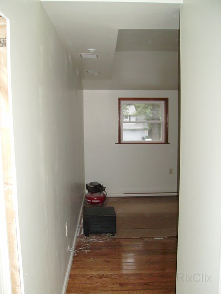 PICT0531.JPG - The windows ore trimmed out in oak. Speakers and reading lights in tray ceiling. Sub-woofer on the floor.