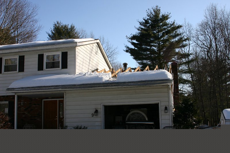 0012.jpg - The roof is removed above the garage and family room