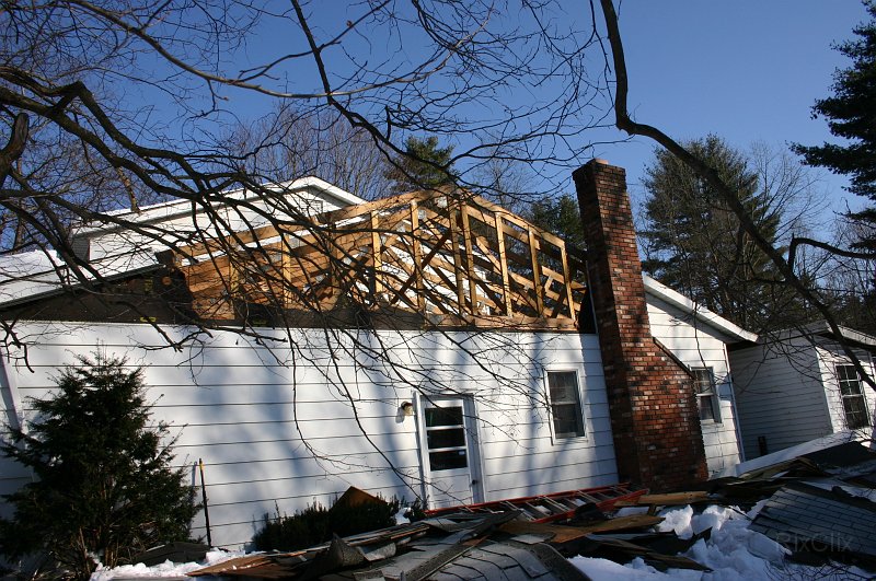 0015.jpg - The roof is removed above the garage and family room